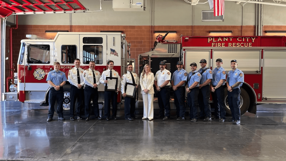 Rep. Laurel Lee with Plant City Firefighters in front of firetruck