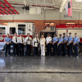 Rep. Laurel Lee with Plant City Firefighters in front of firetruck