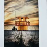 Photo of a beach before a storm, lifeguard stand